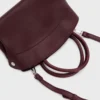 burgundy top handle bag